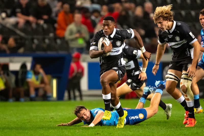 Sport photographer Durban — rugby player breaking through a tackle, Kevin Rom PROFarazzi Media