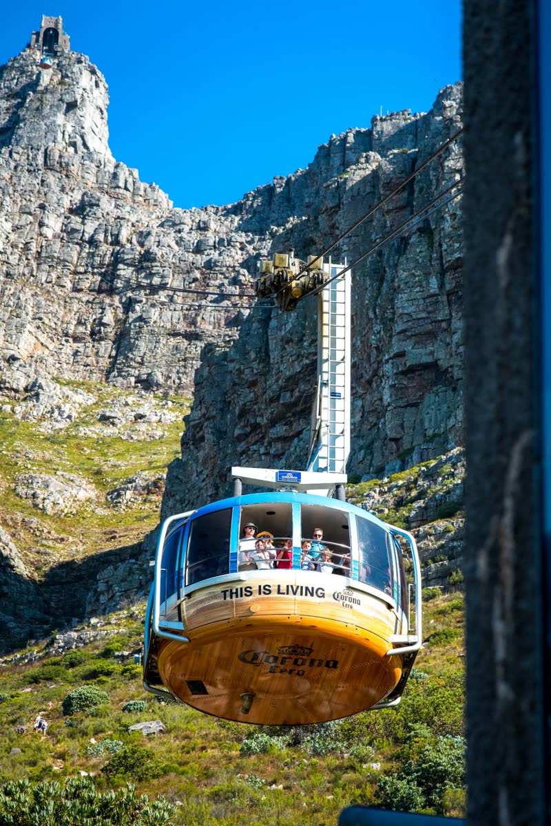 Table Mountain cable car against the cliffs during the Power Monkey retreat in Cape Town